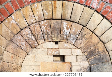 Close Up of An Antique Arch of A Sealed Fireplace  Made of Stones and Bricks.