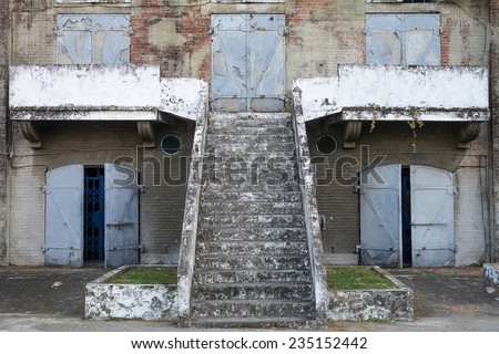 The Facade of An Old Japanese Military Facility, with Heavy Iron Blast Doors And A Stair Leading to The Second Floor. Built in 1917. Located in Kaohsiung, Taiwan.