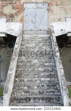 An Old Stair of Concrete Leading Up to A Steel Blast Door, in An Old Japanese Military Facility, Built in 1917,  Located in Kaohsiung, Taiwan.
