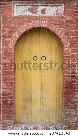 A Classical Chinese Door with Brick Frame With A Banner on Top of The Door. This is  The Inner Side of The Door. A Typical Door For The House Built During The Qing Dynasty in Taiwan.