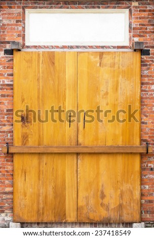 A Classical Chinese Door with Brick Frame With A Banner on Top of The Door. This is  The Inner Side of The Door. Its Style is Typical For The House Built During The Qing Dynasty in Taiwan.