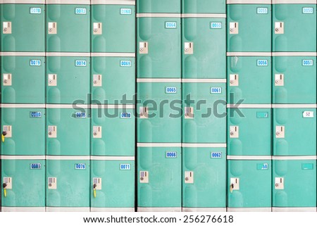 A Wall of Temporary Storage Lockers of Green Color.