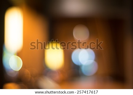 Abstract Background of Defocused Scene of A Corridor With Warm Lights And Billboards.