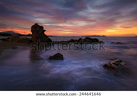 Stone sunset light Sea waves