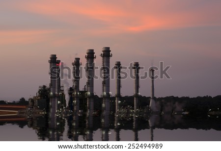 Petroleum  chemical  industry and Oil Refinery reflected light water sunset industry in  Thailand.