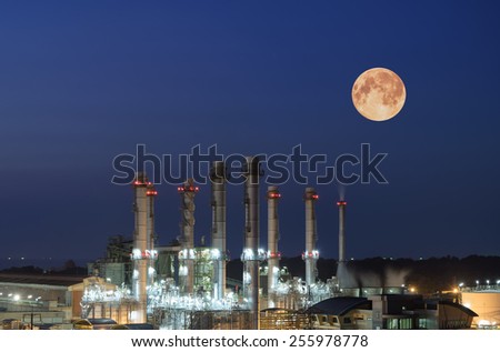 Oil Refinery twilight with moon in thailand.