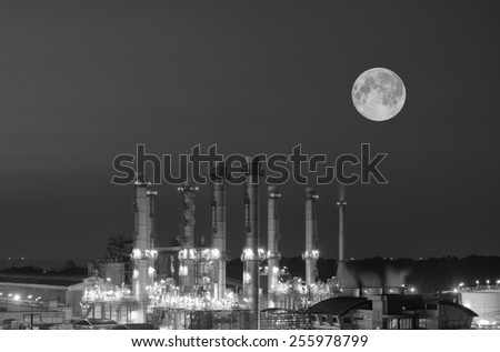 Oil Refinery twilight with moon in thailand black and white tone.
