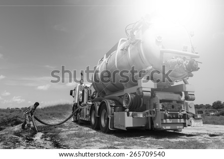 emergency  Vacuum truck  for oil spill  refinery oil plant black and white tone.