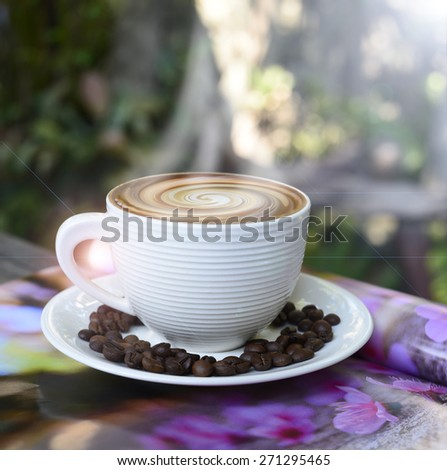 hot coffee, smoke on surface coffee mugs  ,cup of coffee on magazine.