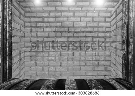 empty room with brown brick wall and wooden floor platform.
