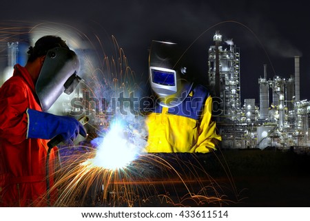 Industrial worker welding metal with many sharp sparks and worker during use electric wheel grinding
