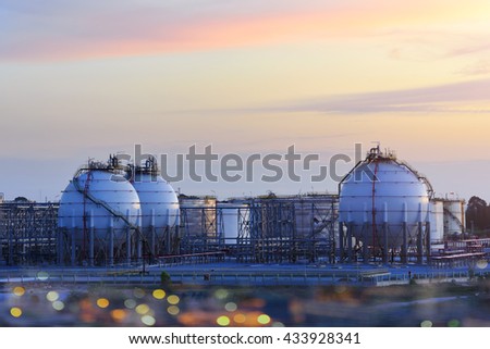 A large oil-refinery plant with Liquefied Natural Gas (LNG) storage tanks.