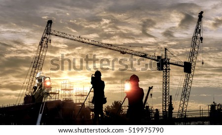 Double exposure of silhouette black man survey and civil engineer stand on ground working in a land building site over Blurred construction worker on construction site. examination, inspection, survey
