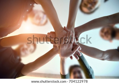 Team Teamwork Join Hands Partnership Concept  . Diverse Group of People Hands Together Partnership Teamwork .
