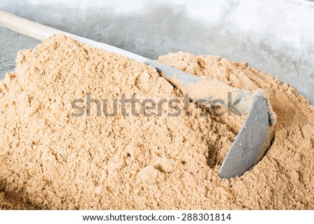 Pick up a shovel cement concrete mix is compacted sand. Waiting to be mixed with cement
