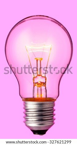 Glowing yellow light bulb, realistic photo image of a turned on tungsten light bulb with a pink background and a clipping path