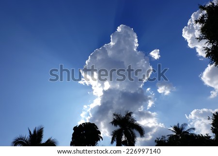 Surreal sun rays are striking through the clouds like an explosion