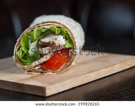 Chicken kebab in pita bread with vegetables