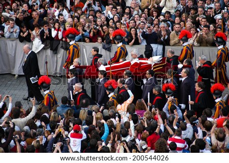 ROME, ITALY-APRIL 05, 2005: Death of John Paul II. The body of Pope passes through the crowd in St. Peter square, Vatican City.