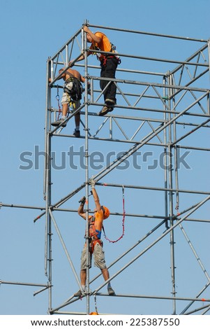Safety at work. Workers on the scaffolding