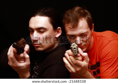 Two guys playing with gun