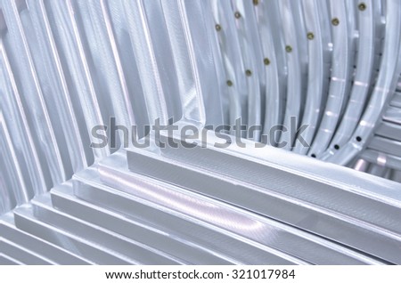Abstract background of side of Aluminium Pipe bending forming. Part of furniture