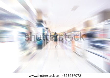 Abstract background of business people in blurred motion walking. Business people walking in luxurious shop store corridor