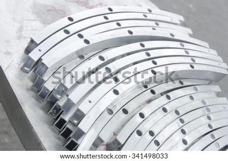 stacks of bending aluminium pipes. Furniture industrial parts