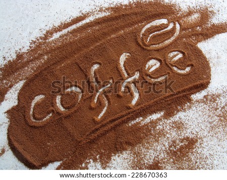 Coffee word written on to powdered coffee and coffee bean