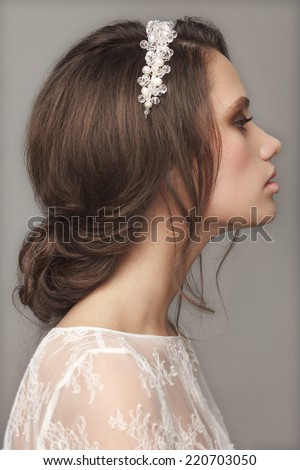 Beautiful young woman with bridal makeup and hairstyle. Wedding trends