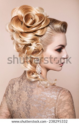 Beautiful woman with evening make-up and salon hairdo .Complicated hairstyle for party
