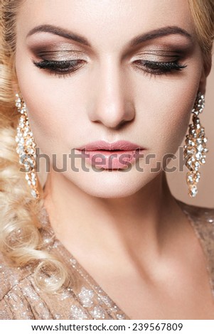 Beautiful woman with evening make-up and perfect skin. Party look
