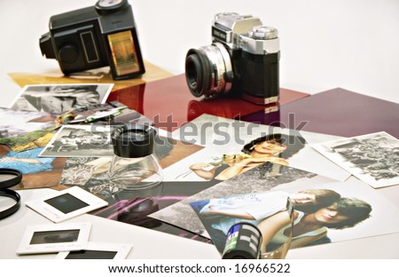 A scene with old photography cameras and their photos