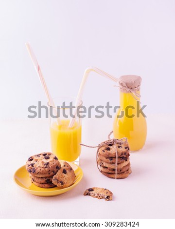 Homemade cookies with chocolate and orange juice. Isolated on a white background.
