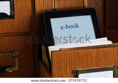 Ebook Reader in a Library  - New Technology Concept