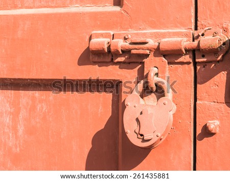 old padlock on the old gate background in Thailand