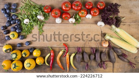 Fresh vegetables on a wooden background. Art Border Design