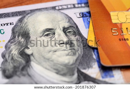 Close-up credit cards on dollars notes with shallow depth of field