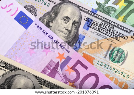 Dollar and euro bank notes on the table