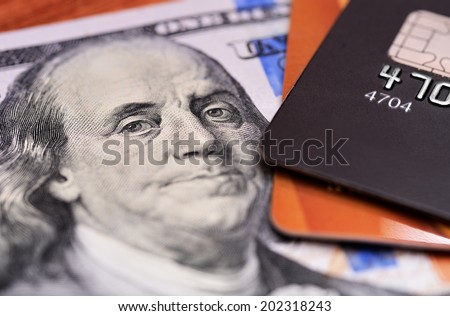 Close-up credit cards on dollars notes with shallow depth of field