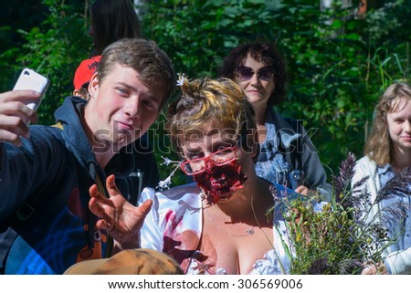 Saint Petersburg, Russia - August 15, 2015: people dressed as zombies parade on the street while walking in St. Petersburg zombie, the zombie walk is part of the event a flash mob.