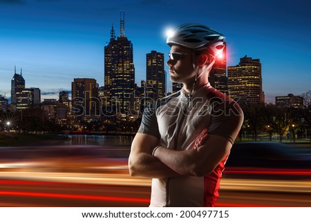 Cyclist at night with bike lights on his helmet