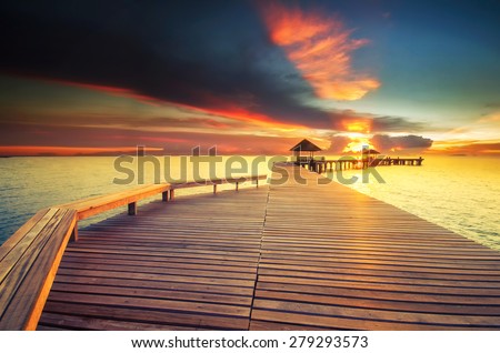 Wooded bridge in the port between on sunrise time at Rayong,Thailand
