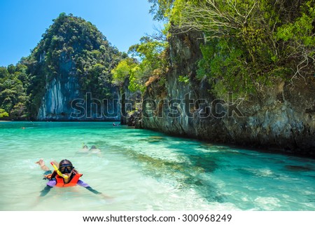 Asia Young lady snorkeling in Tropical beach scenery, Andaman sea, View of koh hong island krabi,Thailand
