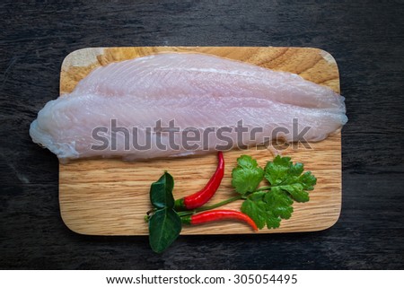 dolly fish raw meat and spice ingredient prepare cooking on wood