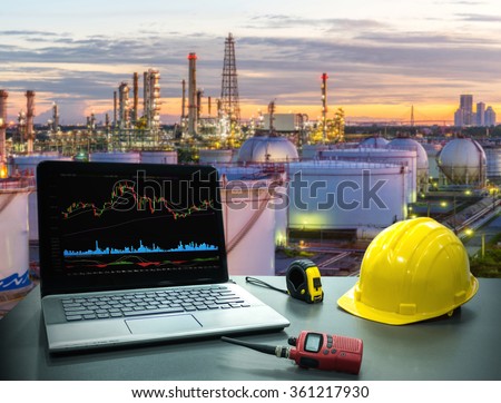 Business concept, industry. Laptop desk on with Oil and gas industry background