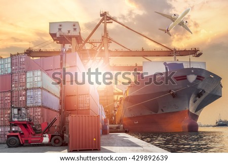 Forklift handling container box loading and Container Cargo freight ship with working crane bridge in shipyard at sunrise for Logistic Import Export background