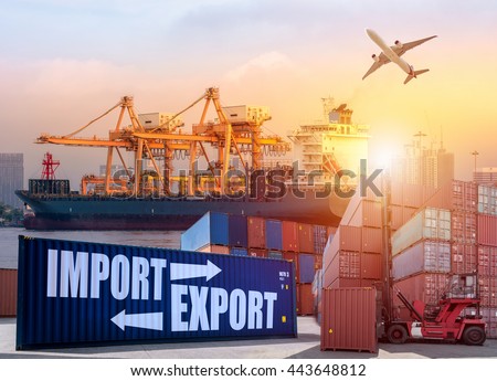 Container Cargo freight ship with working crane bridge in shipyard at sunrise for Logistic Import Export background