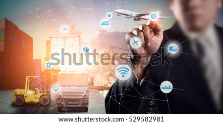 Businessman is pressing button on touch screen interface in front for Logistic Import Export background, Internet of Things concept