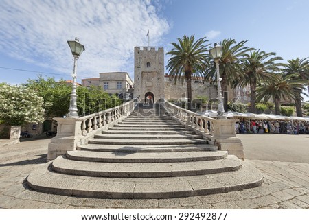 KORCULA, CROATIA - JUNE 19, 2015: Entrance  with stairs and gate tower Big Revelin in dalmatian town Korcula, Croatia
